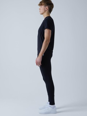 Coupe slim Pantalon de sport 'Long Running Tights' SPORTKIND en noir