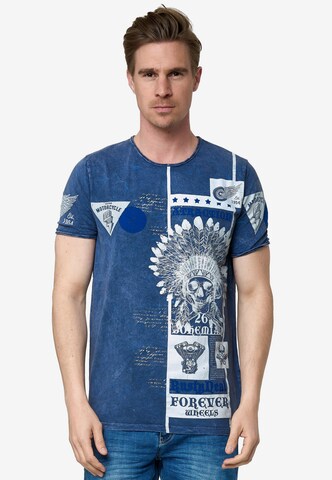 Rusty Neal T-Shirt mit Oil Washed Skull All Over Front Print in Blau: predná strana