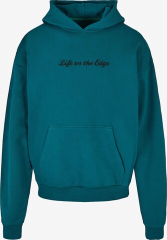 Merchcode Sweatshirt 'Peanuts - Life on the edge' in Green: front