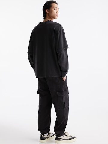 Pull&Bear Tapered Jeans in Schwarz