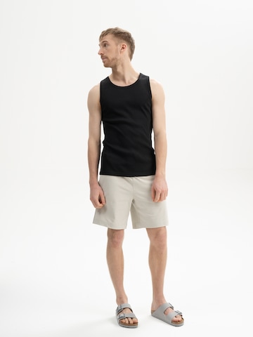 MELA T-shirt 'CHETAN' i svart