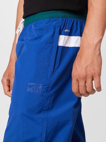 PUMA Tapered Sportbroek 'Clyde' in Blauw