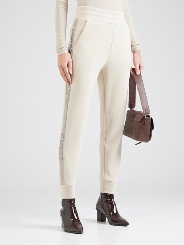 Tapered Pantaloni 'VICTOIRE' di GUESS in beige: frontale