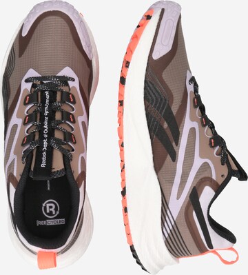 Reebok Loopschoen 'Energy 4' in Bruin