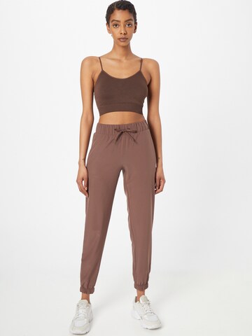 Athlecia Tapered Sports trousers 'Austberg' in Brown