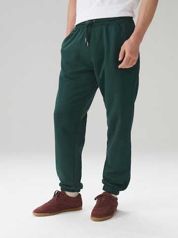 Next Tapered Trousers in Green: front