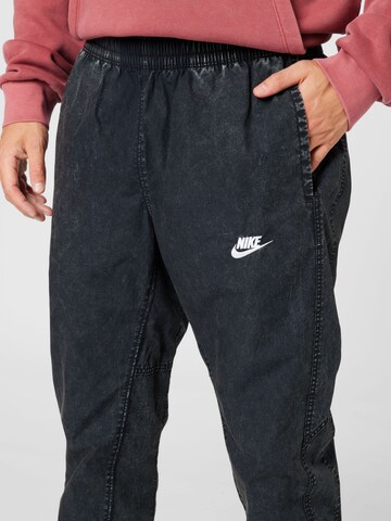 Nike Sportswear Дънки Tapered Leg Панталон в черно