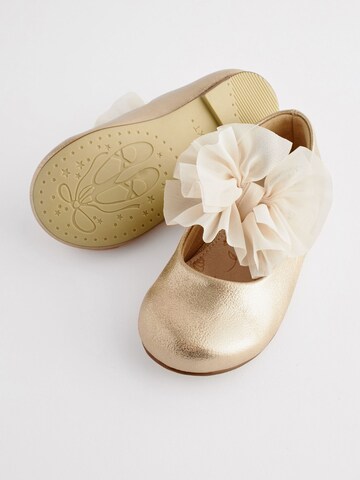 Next - Bailarina en oro