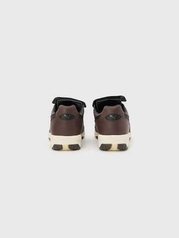 PUMA Низкие кроссовки 'King' в Коричневый