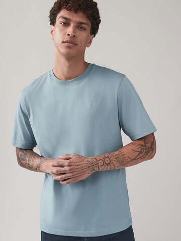 Tricou de la Next pe albastru: față