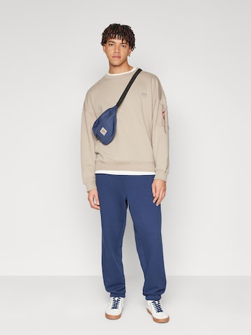 ALPHA INDUSTRIES Tapered Trousers 'Essentials' in Blue