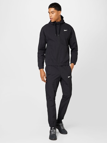 Reebok Sports Suit in Black: front