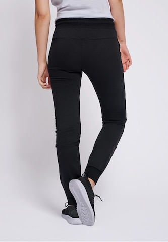 Coupe slim Pantalon de sport Hummel en noir