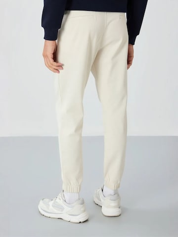 Tommy Life Tapered Workout Pants 'Jogginghose' in Beige
