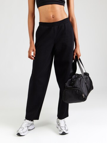 UNDER ARMOUR Regular Workout Pants in Black: front