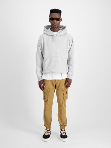 ALPHA INDUSTRIES Zwężany krój Bojówki 'Spy' w kolorze brązowy