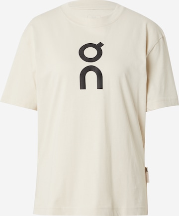 On T-shirt i beige: framsida