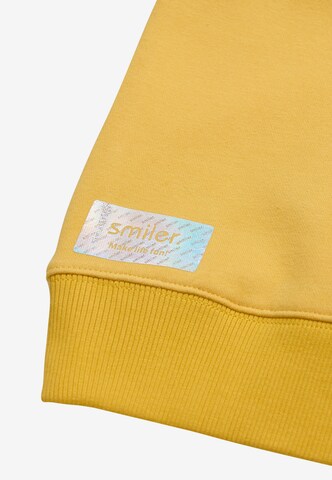 smiler. Kapuzensweatshirt Happy. in Gelb