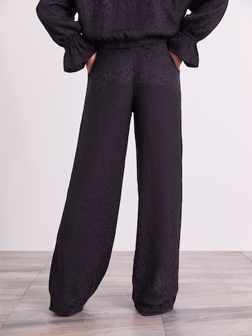 ABOUT YOU x Iconic by Tatiana Kucharova Loose fit Pants 'Vicky' in Black