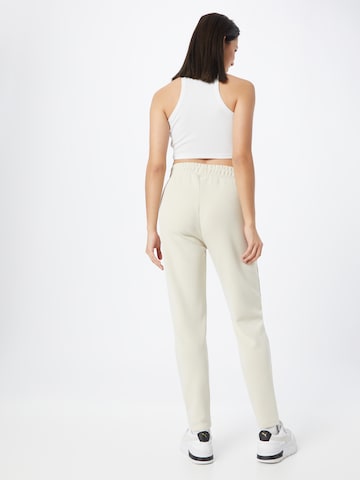 Effilé Pantalon de sport Athlecia en beige