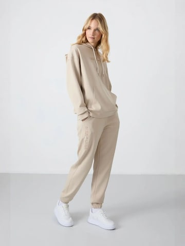 Tuta da jogging di Tommy Life in beige: frontale