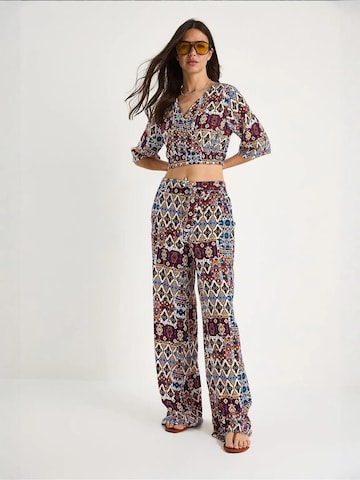 Completo pantalone di Bianco Lucci in rosso