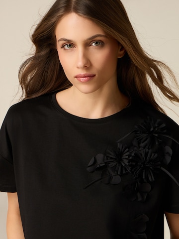 Top di oltre in nero
