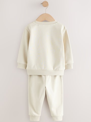 Next Juoksupuku värissä beige