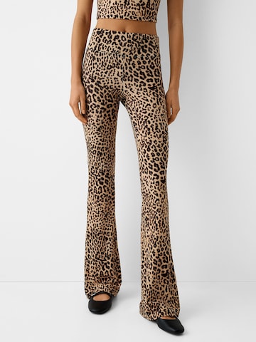 Bershka Flared Trousers in Brown: front