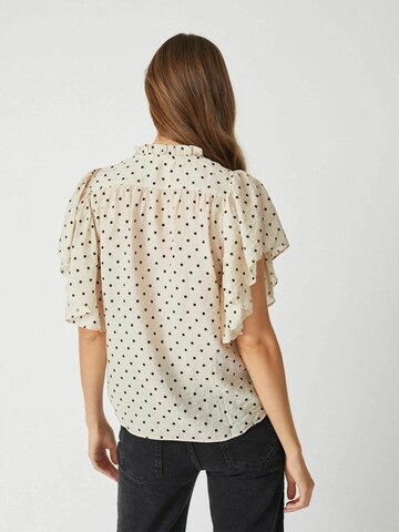 Chemisier 'Dionne' co'couture en beige