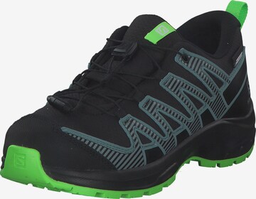 Chaussures basses SALOMON en noir : devant