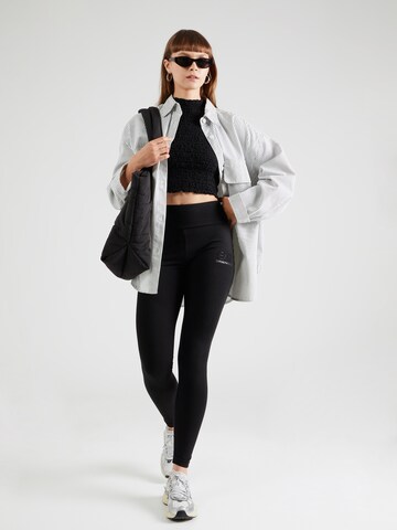 EA7 Emporio Armani Skinny Leggings in Black