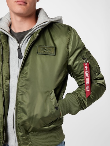 ALPHA INDUSTRIES Between-Season Jacket 'MA-1 D-Tec' in Green