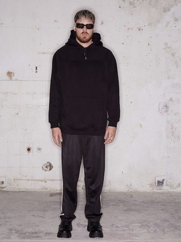 ABOUT YOU x Rewinside Regular Trousers 'Enno' in Black