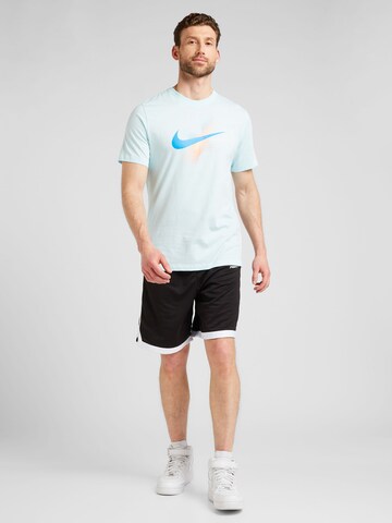 Nike Sportswear T-shirt 'SWOOSH' i blå