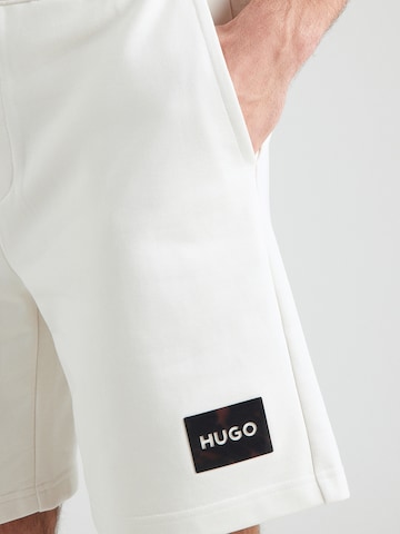 HUGO Loosefit Παντελόνι 'Darix' σε μπεζ