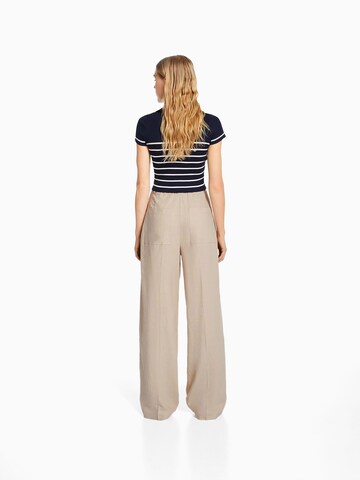 Loosefit Pantaloni con piega frontale di Bershka in beige