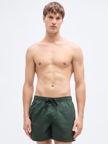 QUIKSILVER Regular Board Shorts 'SOLID 15' in Green: front