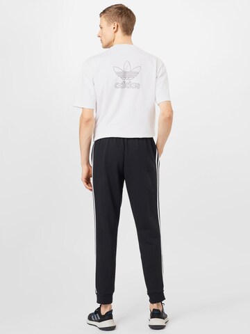 Tapered Pantaloni sportivi 'Essentials Fleece Tapered Cuff 3-Stripes' di ADIDAS SPORTSWEAR in nero