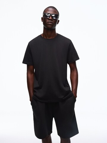 Bershka Trenirka za tek | črna barva: sprednja stran