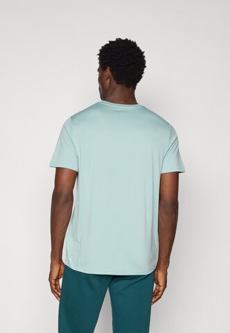 Maglia funzionale 'TAD ESSENTIALS' di PUMA in verde