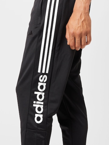 ADIDAS SPORTSWEAR Slimfit Spodnie sportowe 'Tiro Wordmark' w kolorze czarny