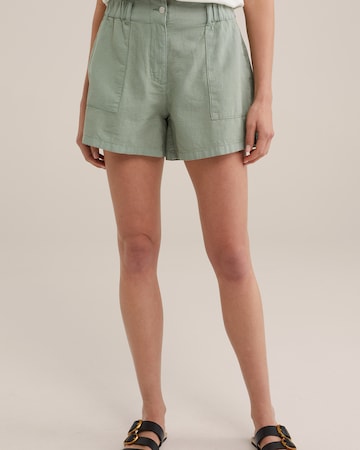 WE Fashion Loose fit Trousers in Green: front