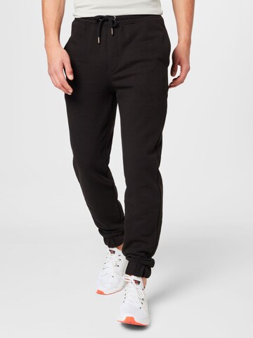 !Solid Tapered Trousers in Black: front