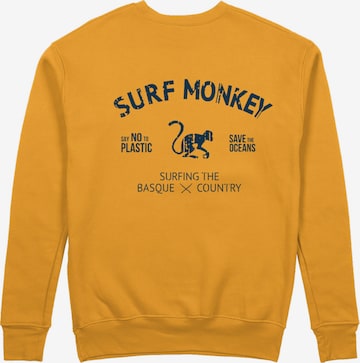 Sweat-shirt 'Rette das Ozean' Surf Monkey en orange : devant
