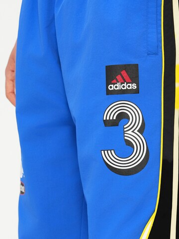 ADIDAS ORIGINALS - Loosefit Pantalón 'Teamgeist' en azul