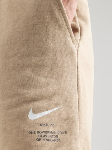 Nike Sportswear Обычный Штаны в Бежевый