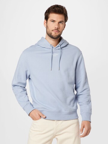 Sweat-shirt Calvin Klein Jeans en bleu : devant