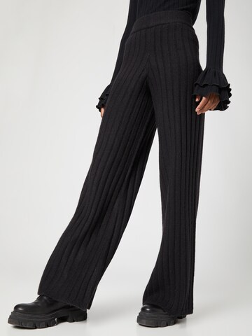 florence by mills exclusive for ABOUT YOU Wide leg Trousers 'Pieris' in Black: front
