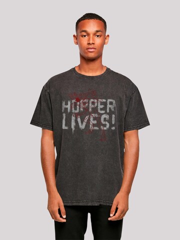 F4NT4STIC Shirt 'Stranger Things Hoppers Live Netflix TV Series' in Zwart: voorkant